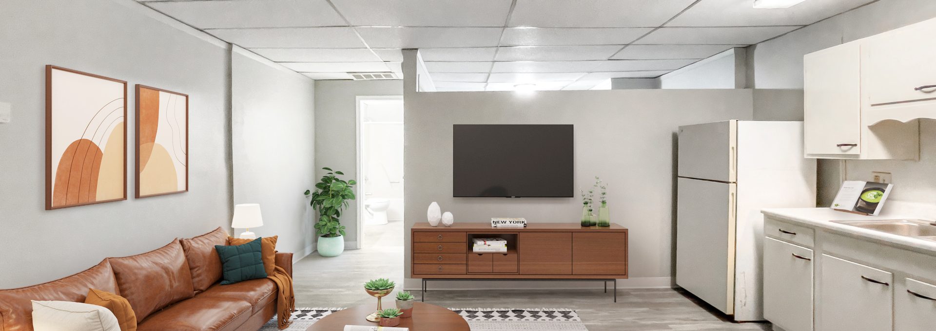 a rendering of a living room with a couch, coffee table and television at The Beacon Hill Apartments